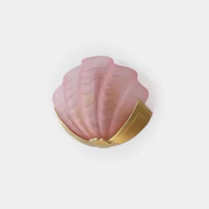 Pink frosted shell wall sconce light with brass base on white background - front view