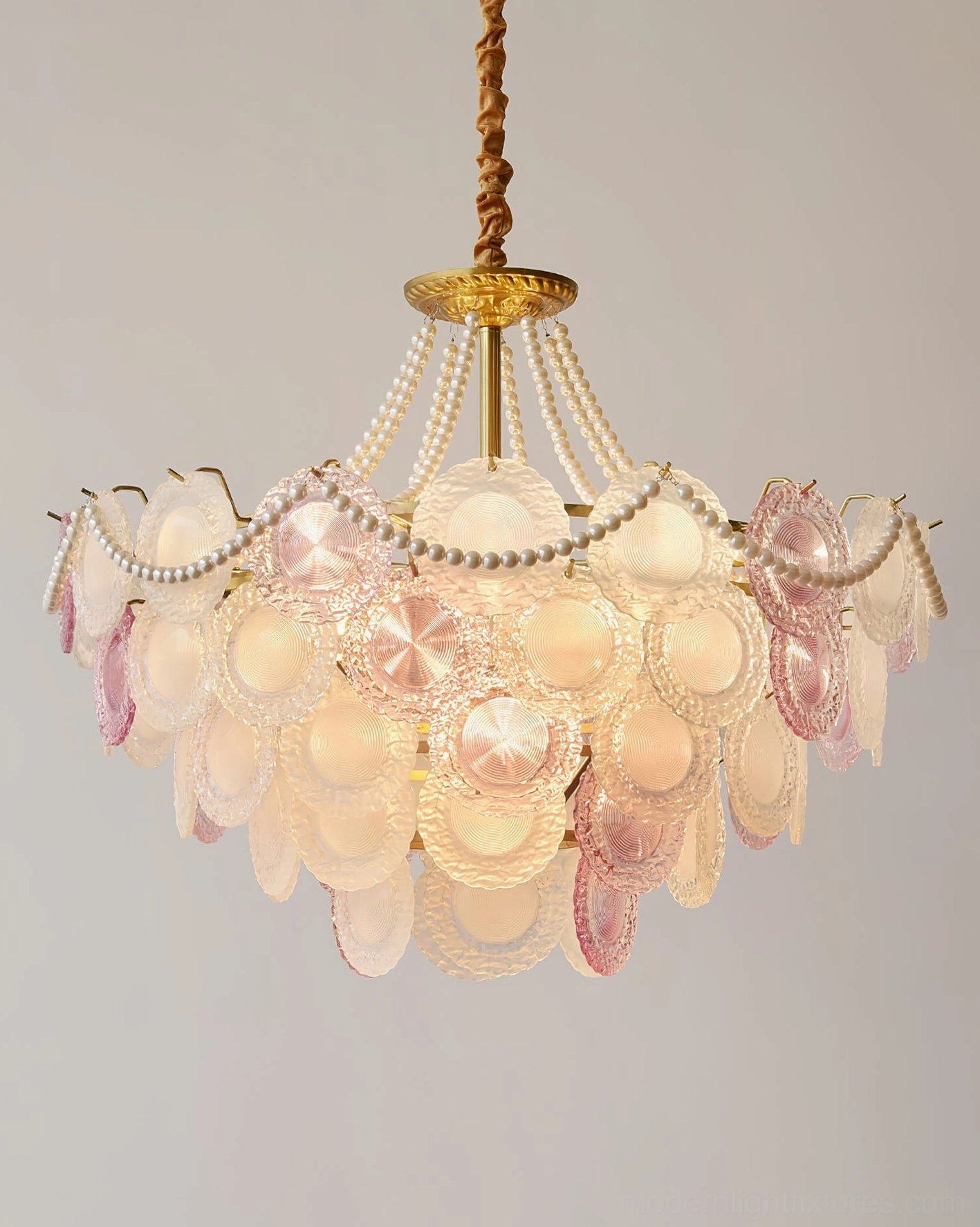 Modern blush pink glass chandelier bottom view highlighting circular glass tiers and central suspension rod