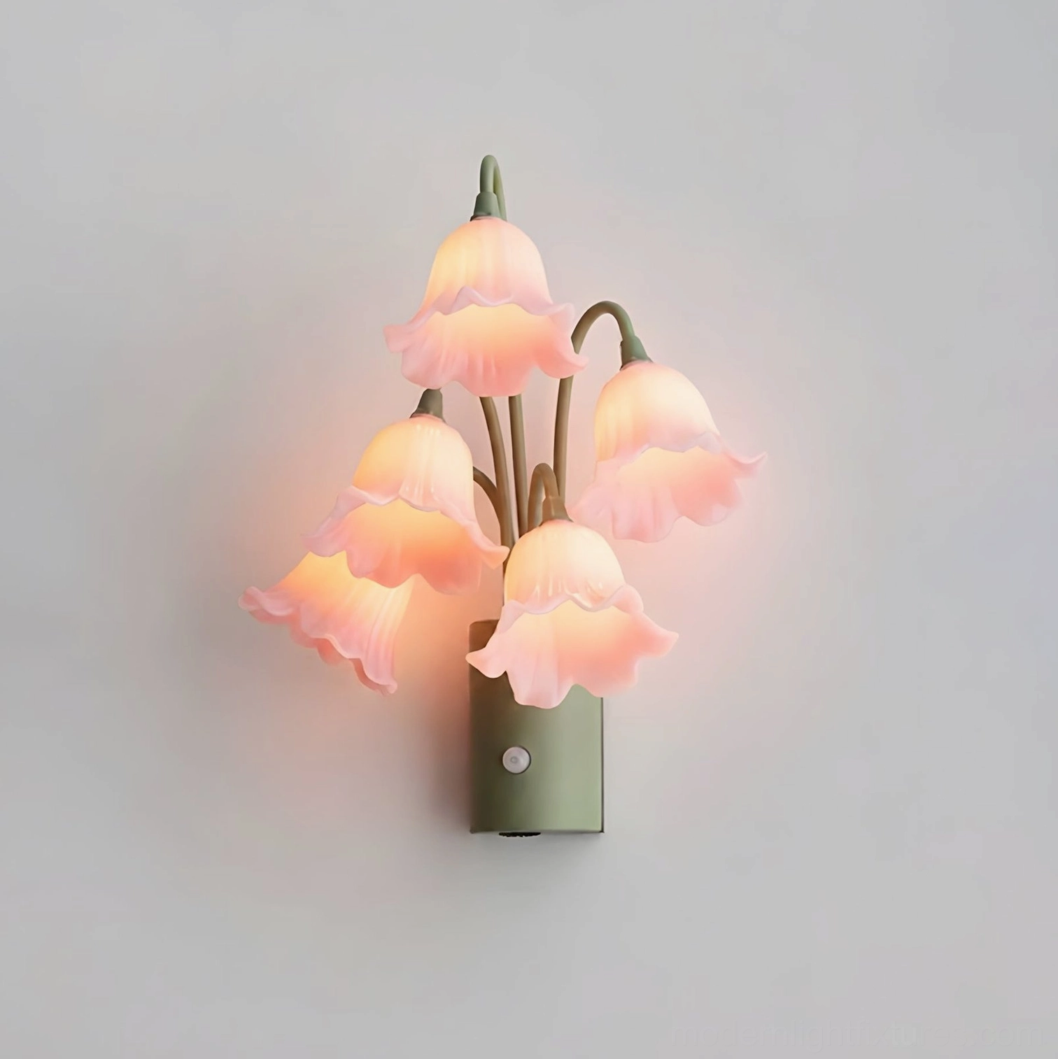 Pink lily bloom wall sconce with soft blush acrylic flower shades on white background