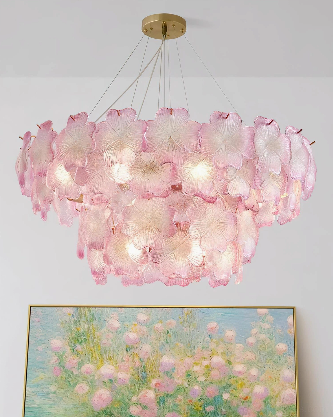 Pink Mika glass petal chandelier three-quarter view showing glowing bulbs and gradient pink details