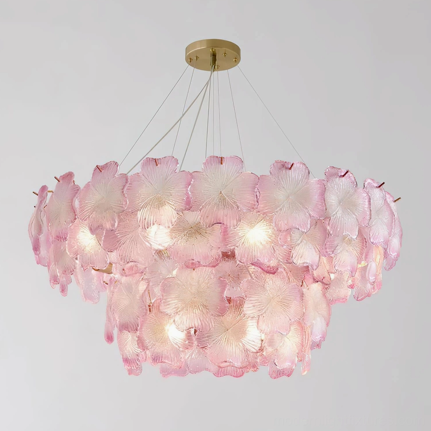 Pink Mika chandelier warm glow detail showing light diffusion through glass petals