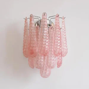 Pink Murano glass sconce with rippled teardrop glass shades and polished chrome mount, angled front view