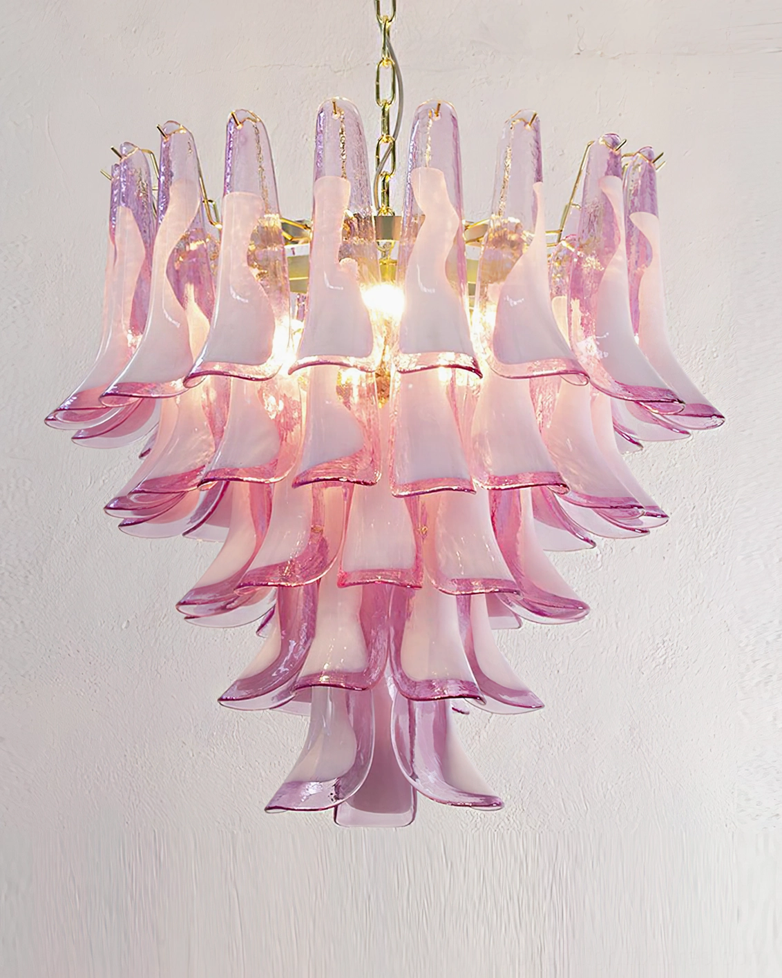 Pink and white Murano glass tulip petal chandelier alternative angle showcasing tiered cascading design and romantic luxury aesthetic