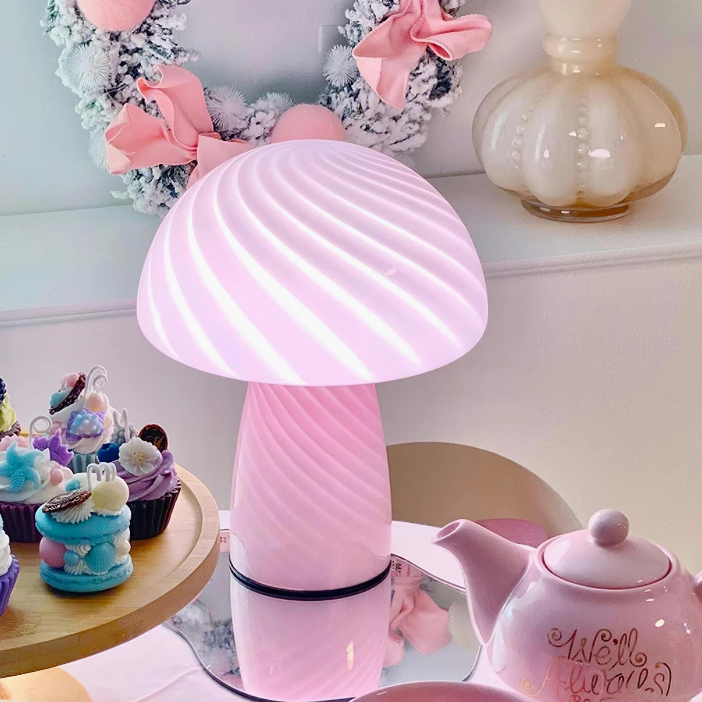 Illuminated pink striped mushroom glass table lamp glowing warm light festive tea party decoration