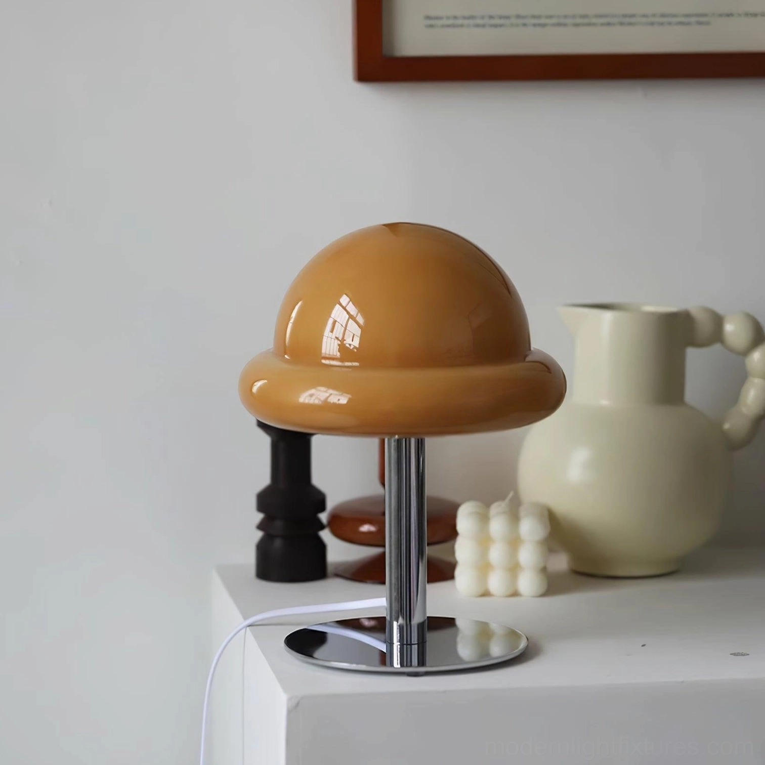 Kleine mushroom lamp in vibrant pink shade on modern nightstand with bedroom accessories