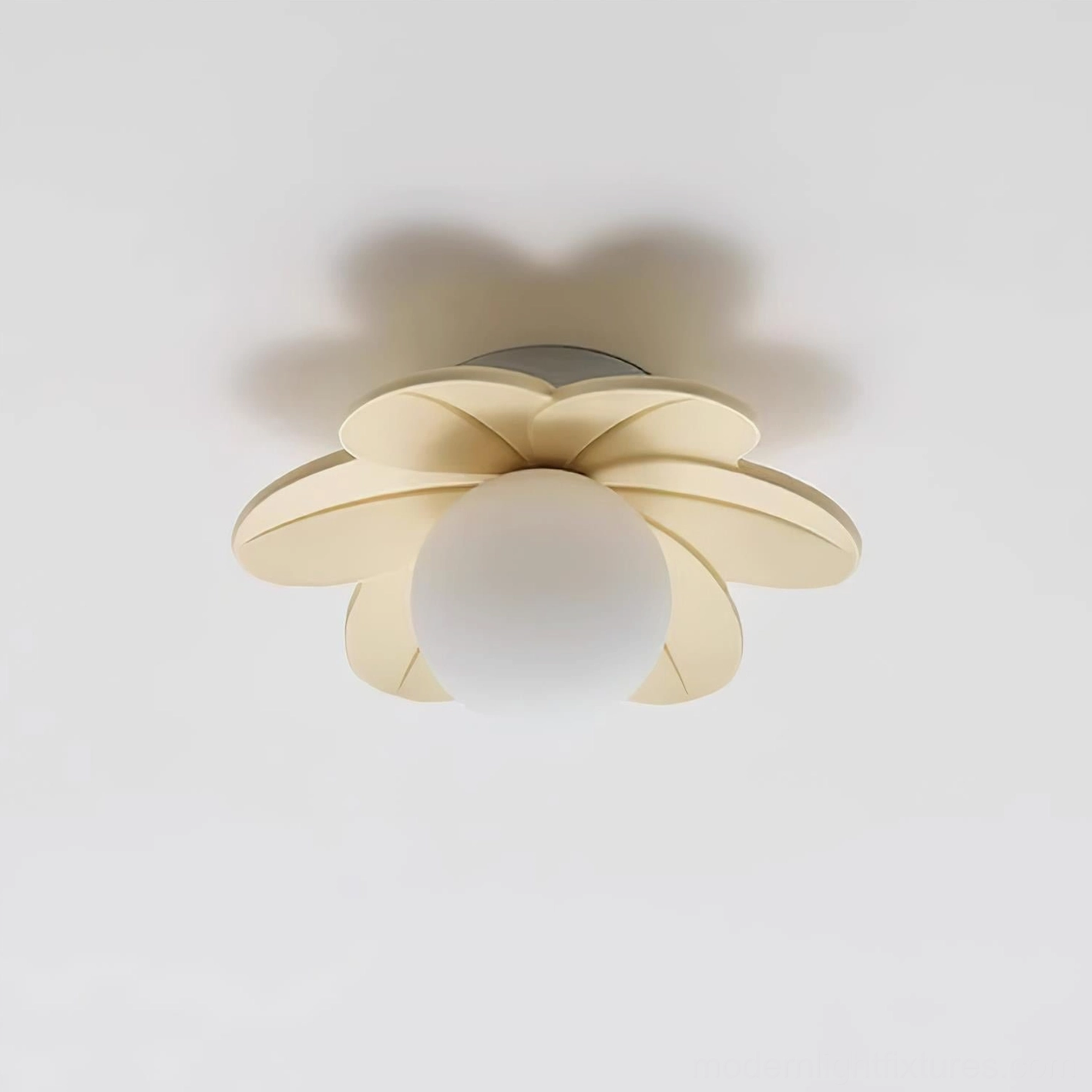 Pink petal flower ceiling light installed in bedroom space with warm ambient glow and minimalist decor