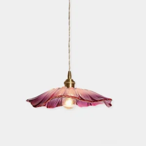Pink botanical petal glass pendant light with ruffled glass shade and copper fitting, front view against white studio background