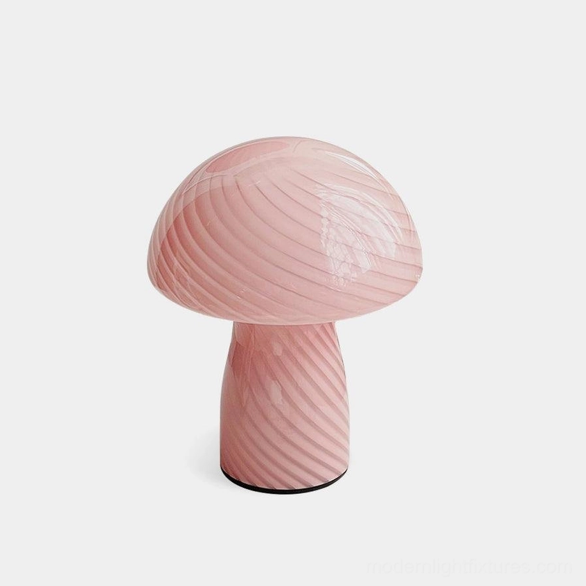 Pastel pink striped Venetian mushroom glass table lamp front view on studio background