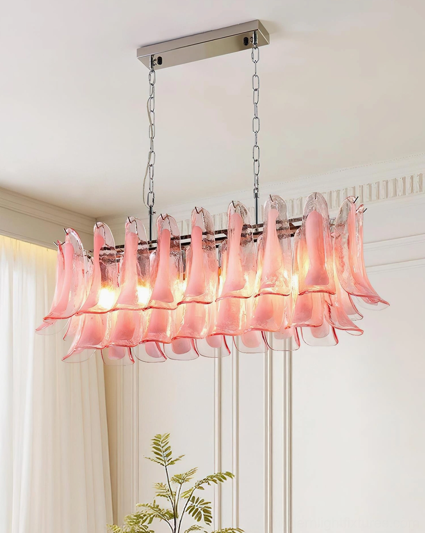 Pink blush tulip leaf glass chandelier with hand-shaped pendants in modern dining room setting