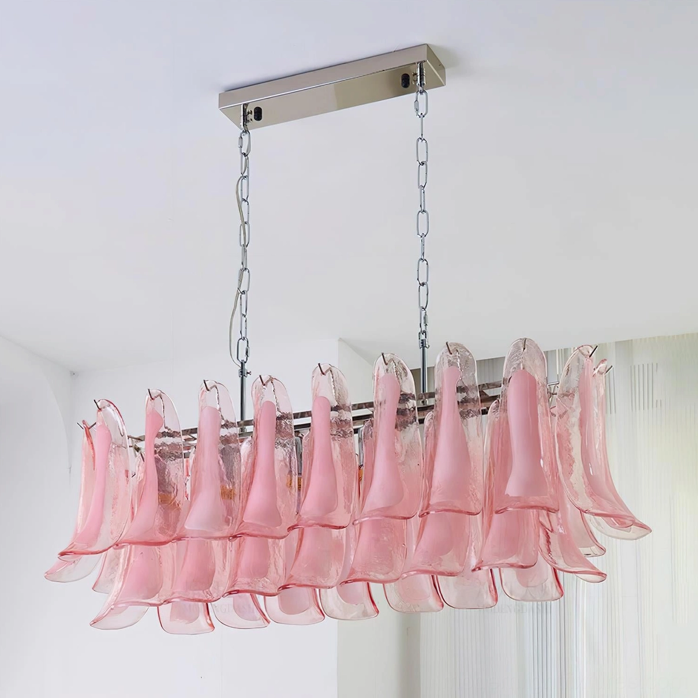 Blush pink tulip leaf chandelier in luxury master bedroom with soft romantic lighting