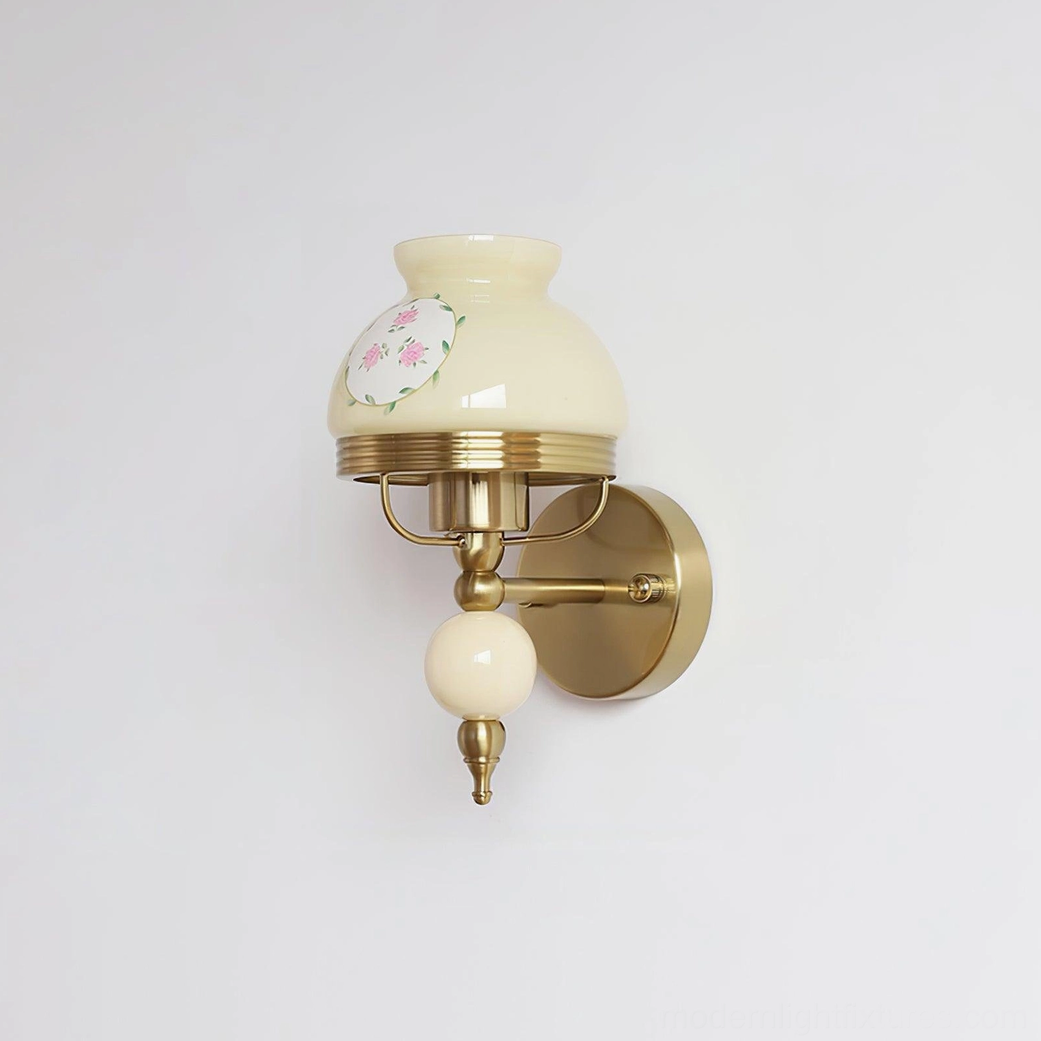 Pink vintage wall lamp with frosted glass shade, floral décor, and brass hardware