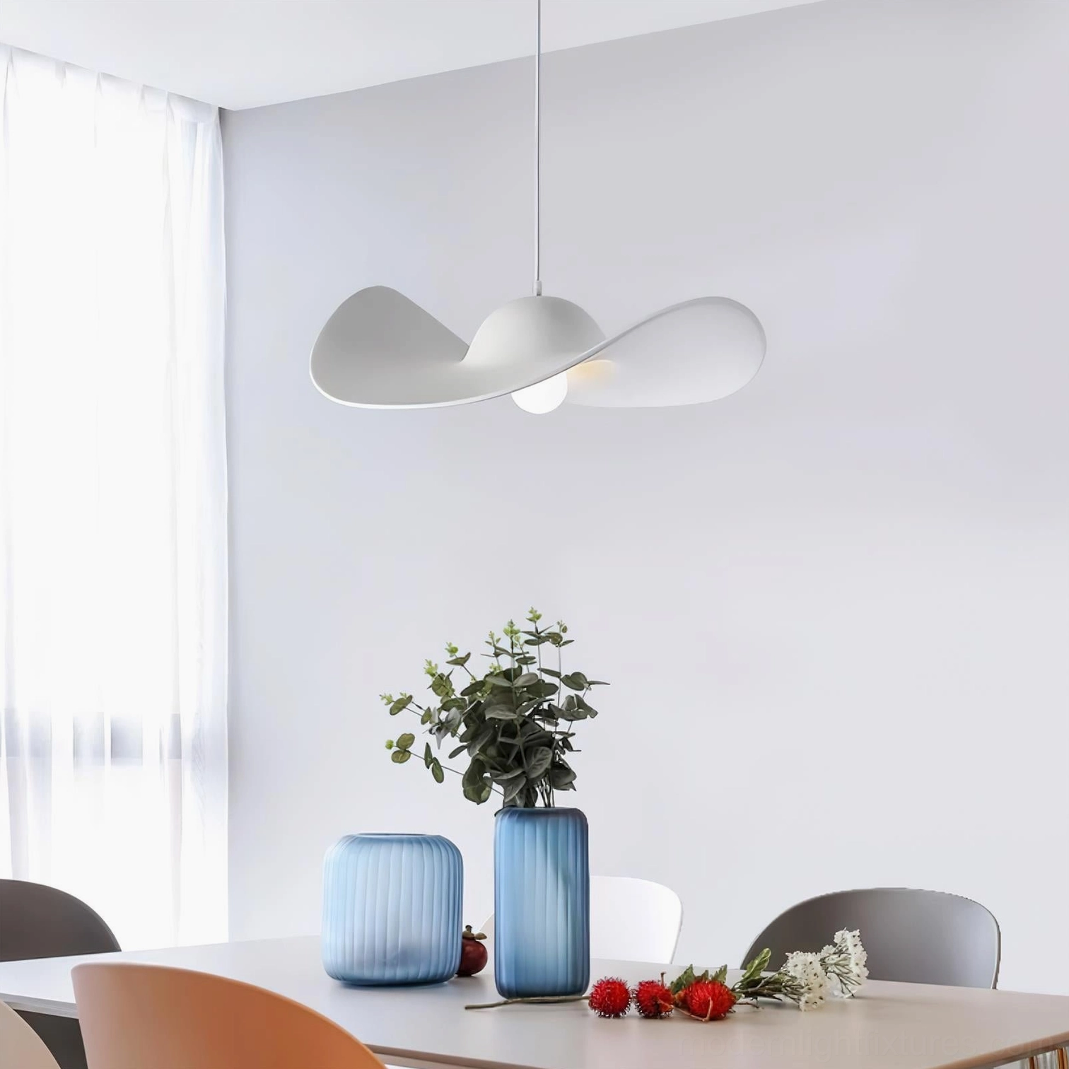Piuma off-white matte pendant light in modern dining room - contemporary minimalist resin fixture