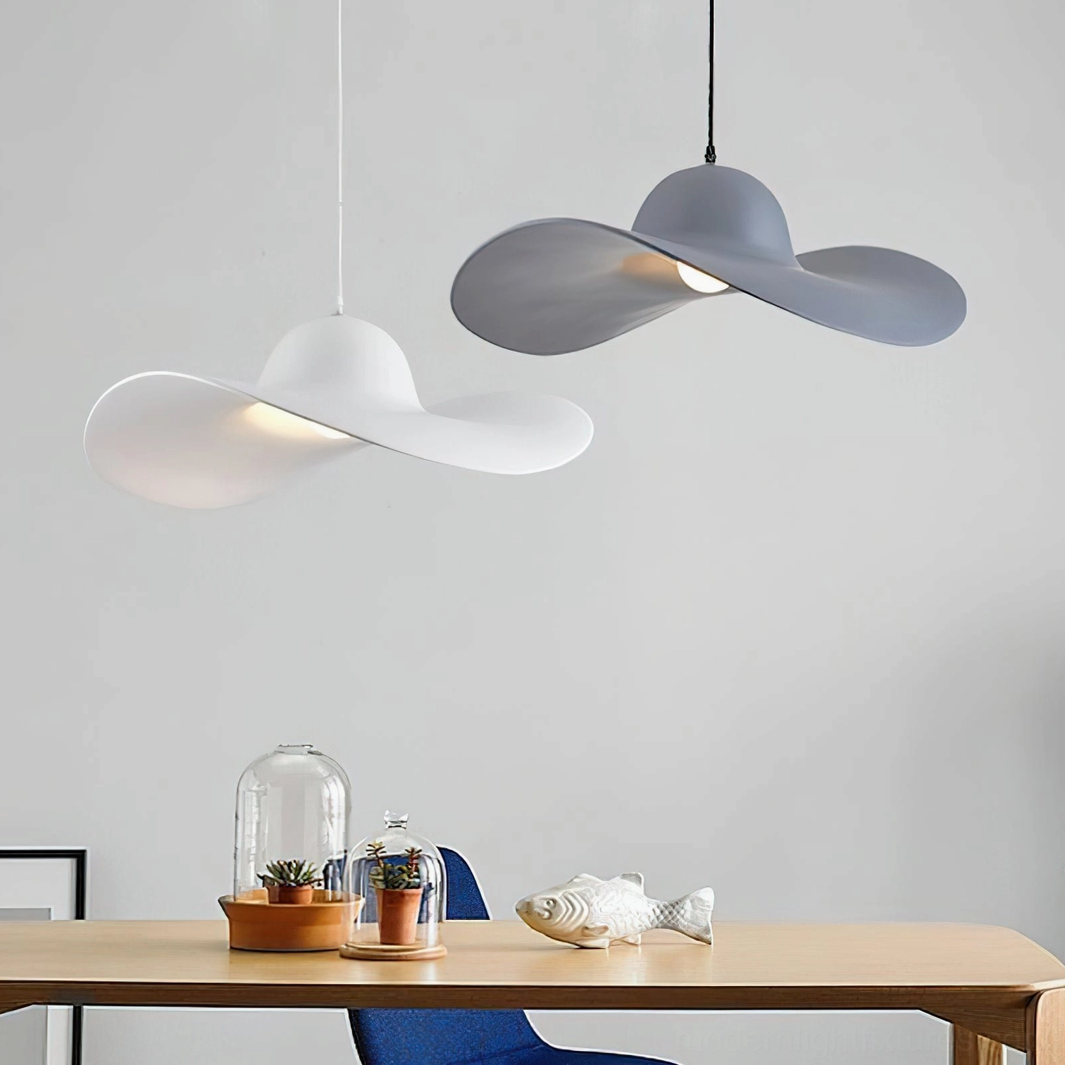 Piuma pendant lights above dining table - white and dark gray matte finish Nordic minimalist design