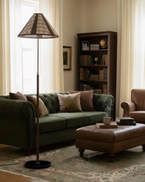 Modern plaid floor lamp positioned beside green velvet sofa in classic living room with area rug