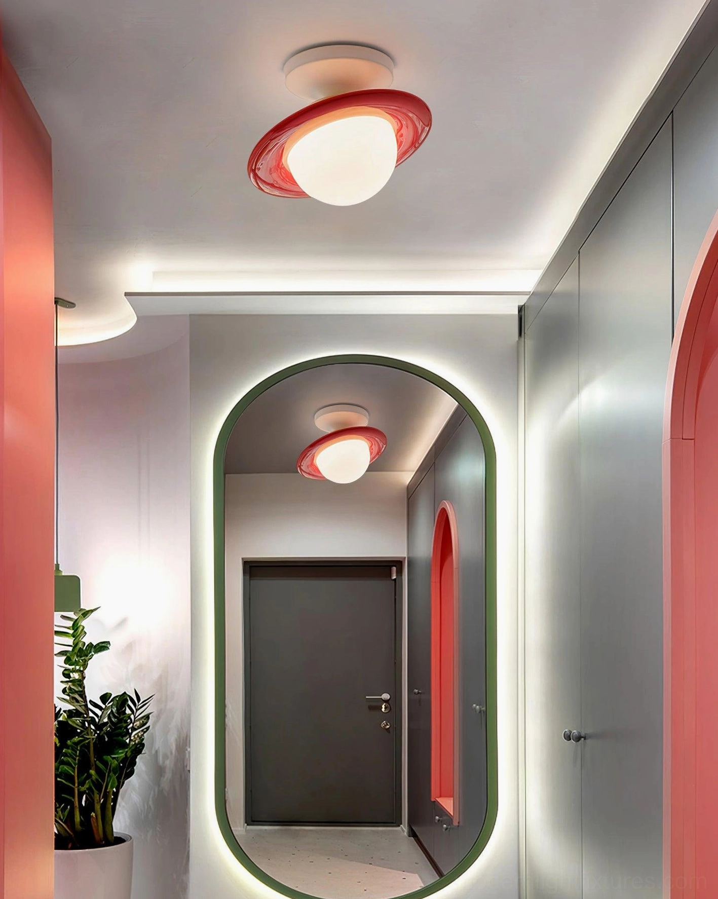 Red trim planet ceiling light reflected in modern arched mirror entryway installation