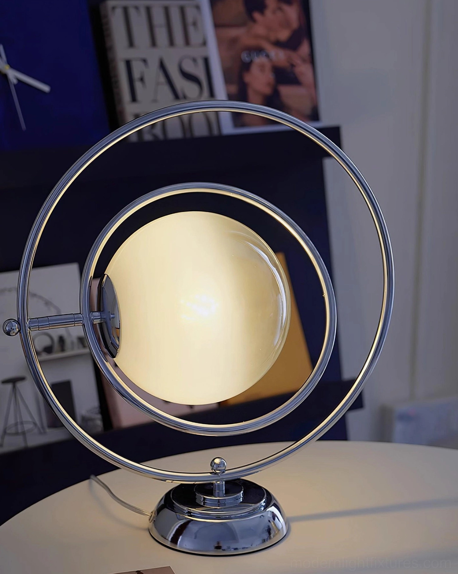 Contemporary rotating planet table lamp on home workspace desk