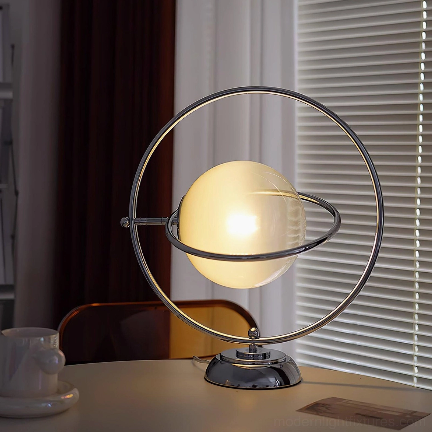 Modern planet table lamp base and metal ring structure close-up