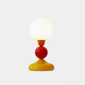 Playdot colorful ball table lamp front view with yellow red and white stacked spheres on white background