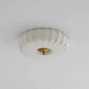 Modern scalloped flush mount ceiling lamp with pleated white shade, top-down ceiling perspective