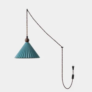 Pleated ceramic plug-in pendant light with teal glaze and walnut wood bead on studio white background, showing vertical ribbed texture and twisted black power cord