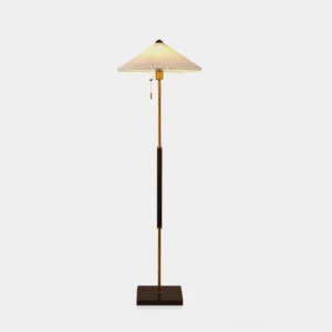 Pleated conical floor lamp with walnut wood stand and brass accents, front studio view