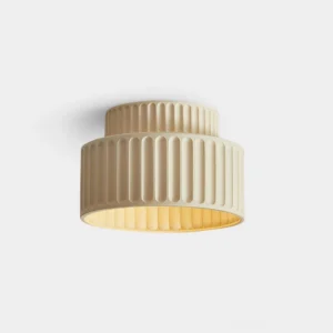 Pleated drum ceiling light fixture with vertical ribbed shade in cream beige color on white background