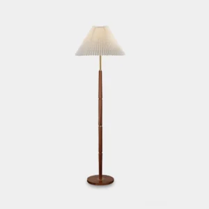 Pleated fabric floor lamp with white shade and walnut wood base on studio background – mid-century modern design