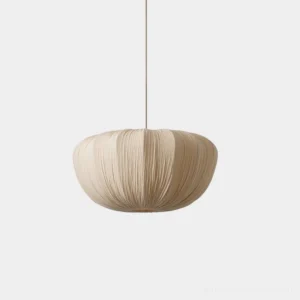 Beige pleated fabric pendant light with minimalist drum shade design, front view showcasing structured woven texture and geometric pleats