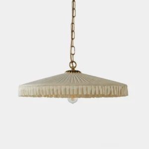 Pleated fabric pendant light with wide parasol shade and brass metal chain, studio front view