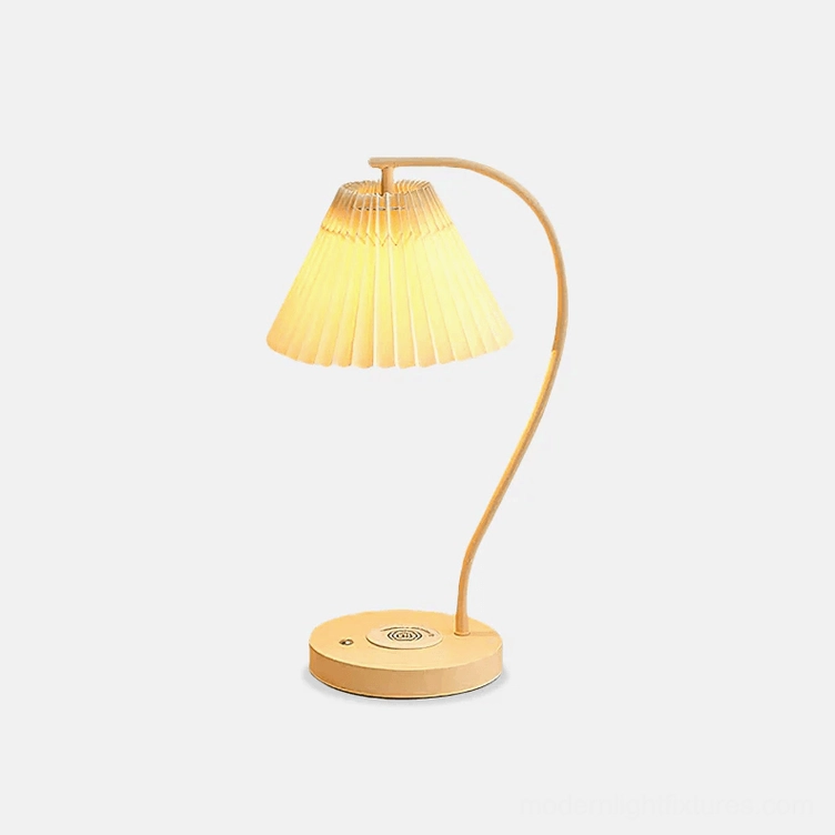 Modern pleated table lamp with cream fabric shade and metal base, front view