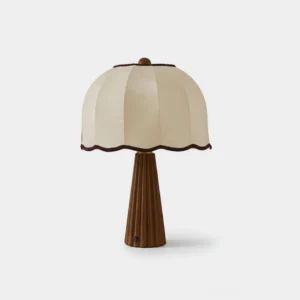 Pleated fabric table lamp with fluted wood base front view - cream shade with scalloped trim and walnut wooden base
