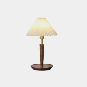 Suki pleated fabric table lamp with brass accents and solid wood base, front studio view on white background
