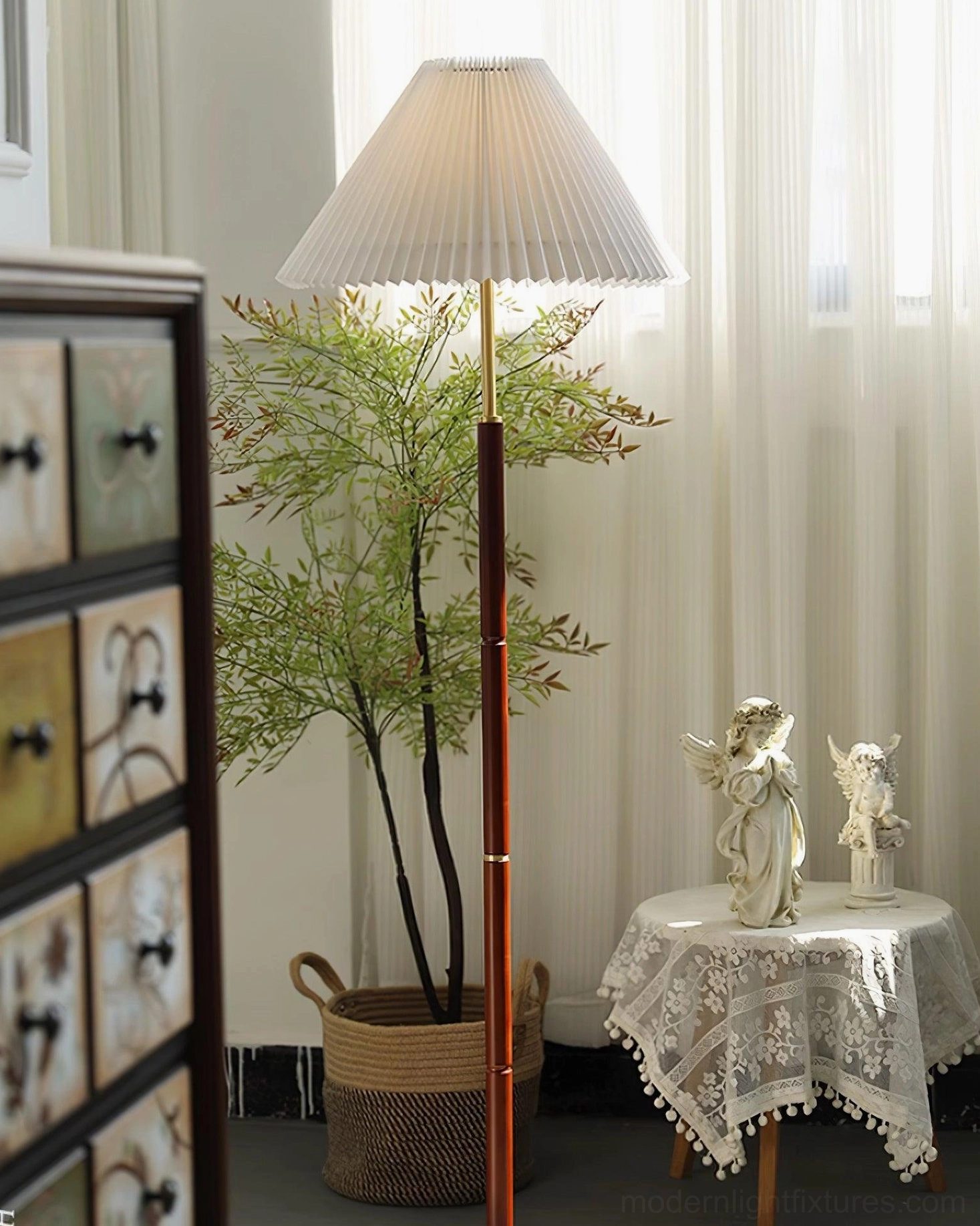 Vintage pleated shade floor lamp with green plant décor in contemporary home interior
