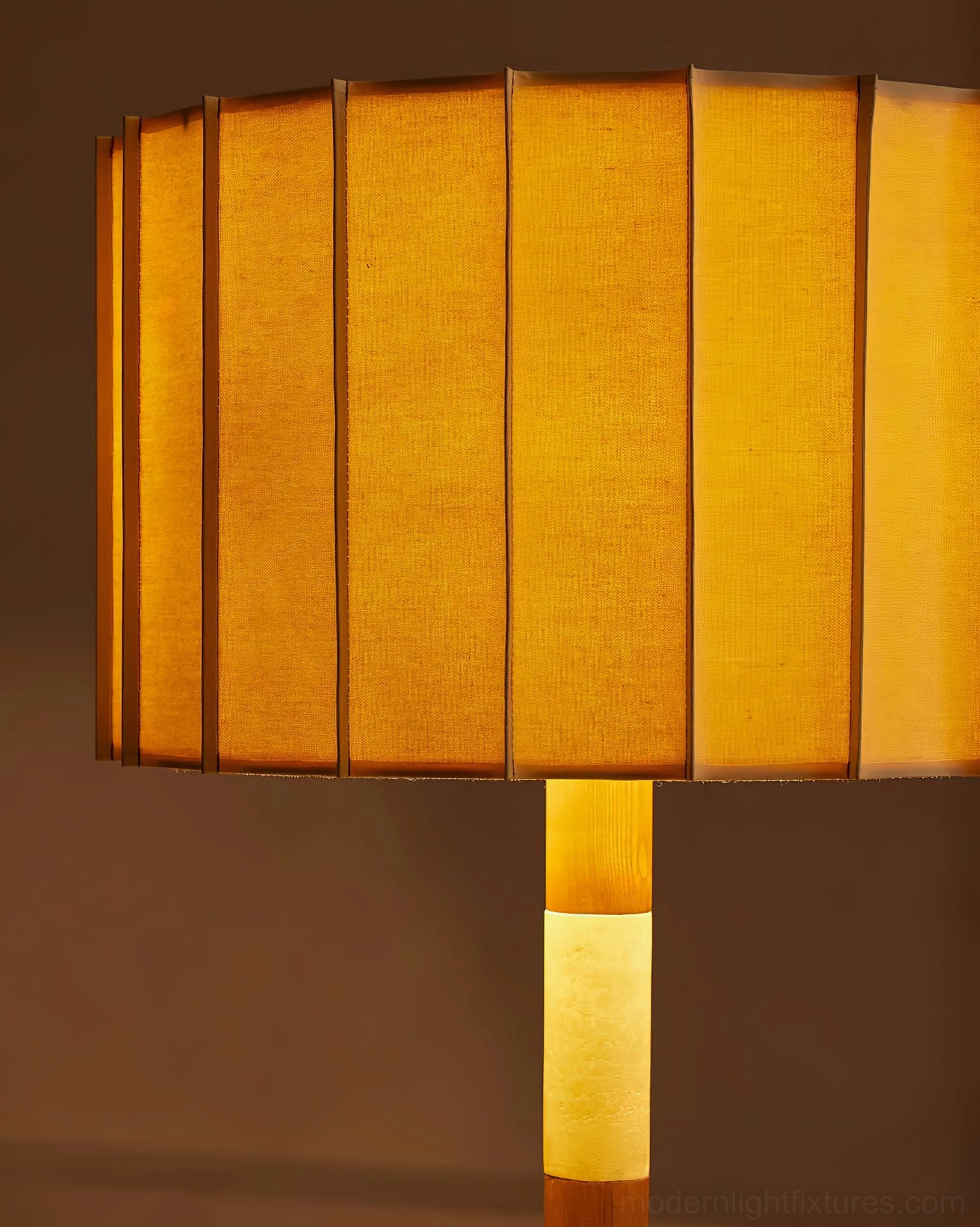 Pleated grove floor lamp in minimalist bedroom setting providing soft ambient lighting from the pleated fabric shade and natural materials