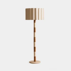 Pleated Grove floor lamp front view studio shot showing two-tone walnut and beige travertine sculptural pole with pleated fabric drum shade