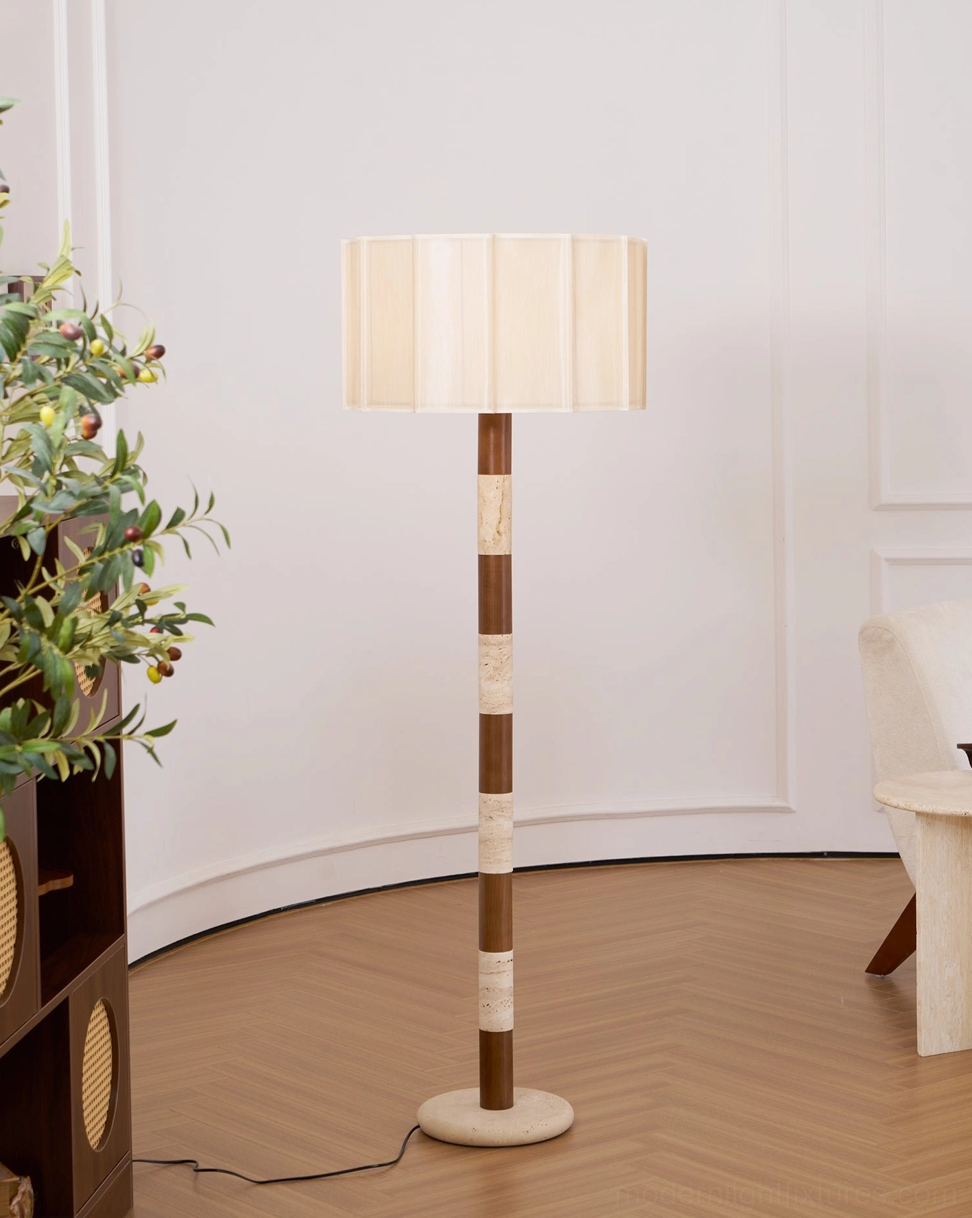 Pleated grove floor lamp in industrial-modern interior beside contemporary furniture showing versatility across design style applications