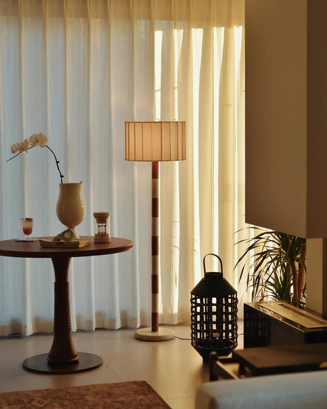 Pleated grove floor lamp in japandi minimalist bedroom interior with natural materials and meditative proportions creating calm atmosphere