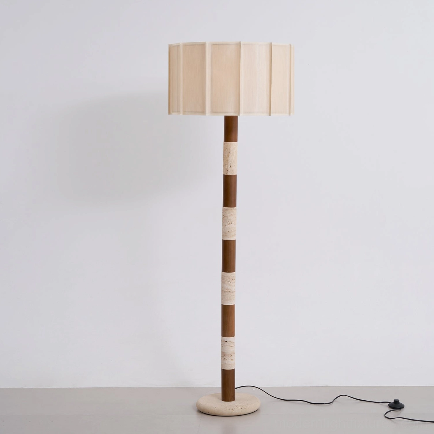 Pleated grove floor lamp in contemporary Scandinavian interior with natural light emphasizing the warm neutral aesthetic and organic materials
