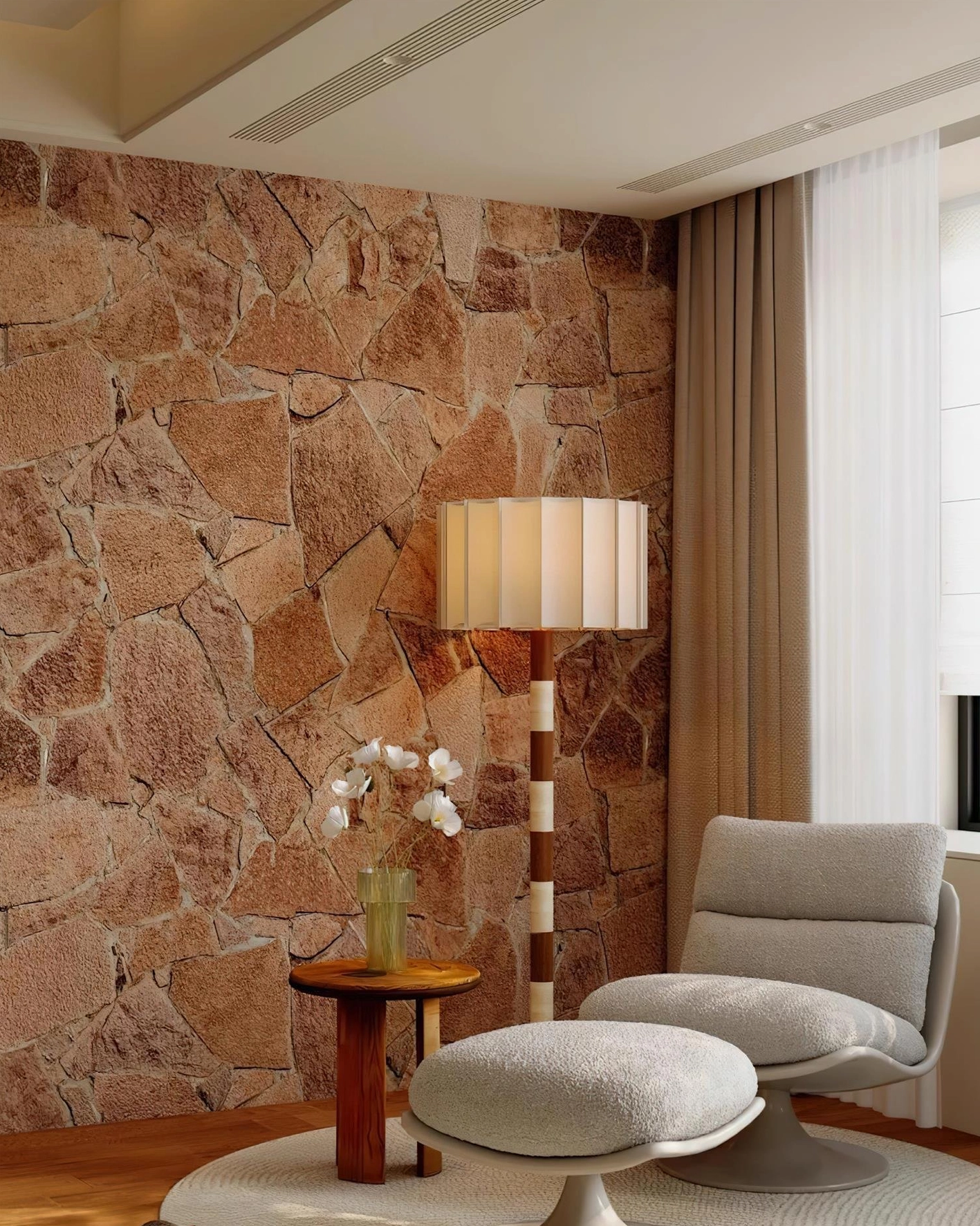 Rear view of pleated grove floor lamp against textured stone wall in lounge space with boucle chairs, warm rustic interior design context