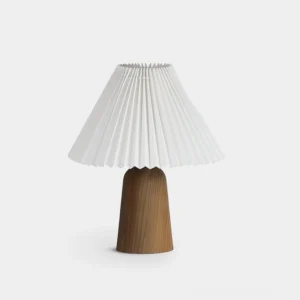 Pleated linen table lamp with wooden base, front view against white background, Nordic minimalist design