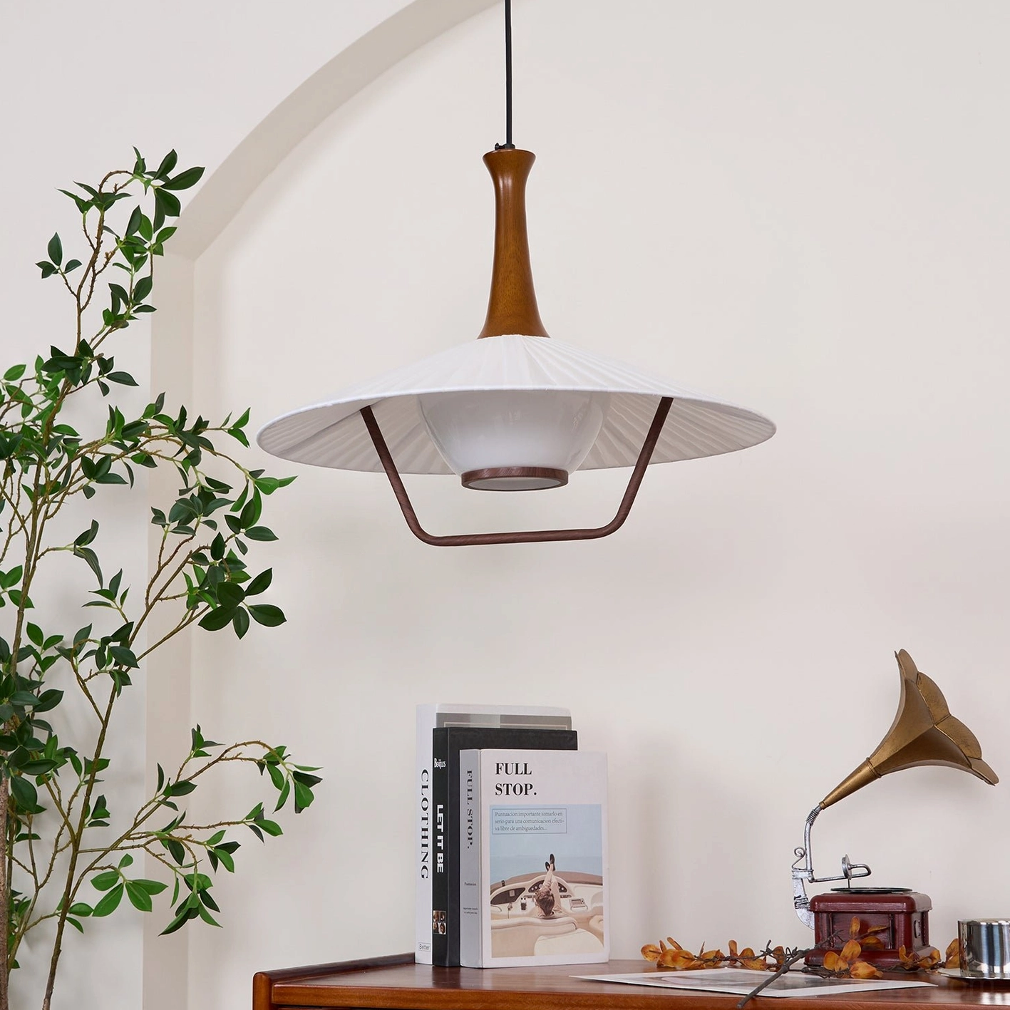Pleated pendant light detail view accordion fold craftsmanship brass metal frame junction