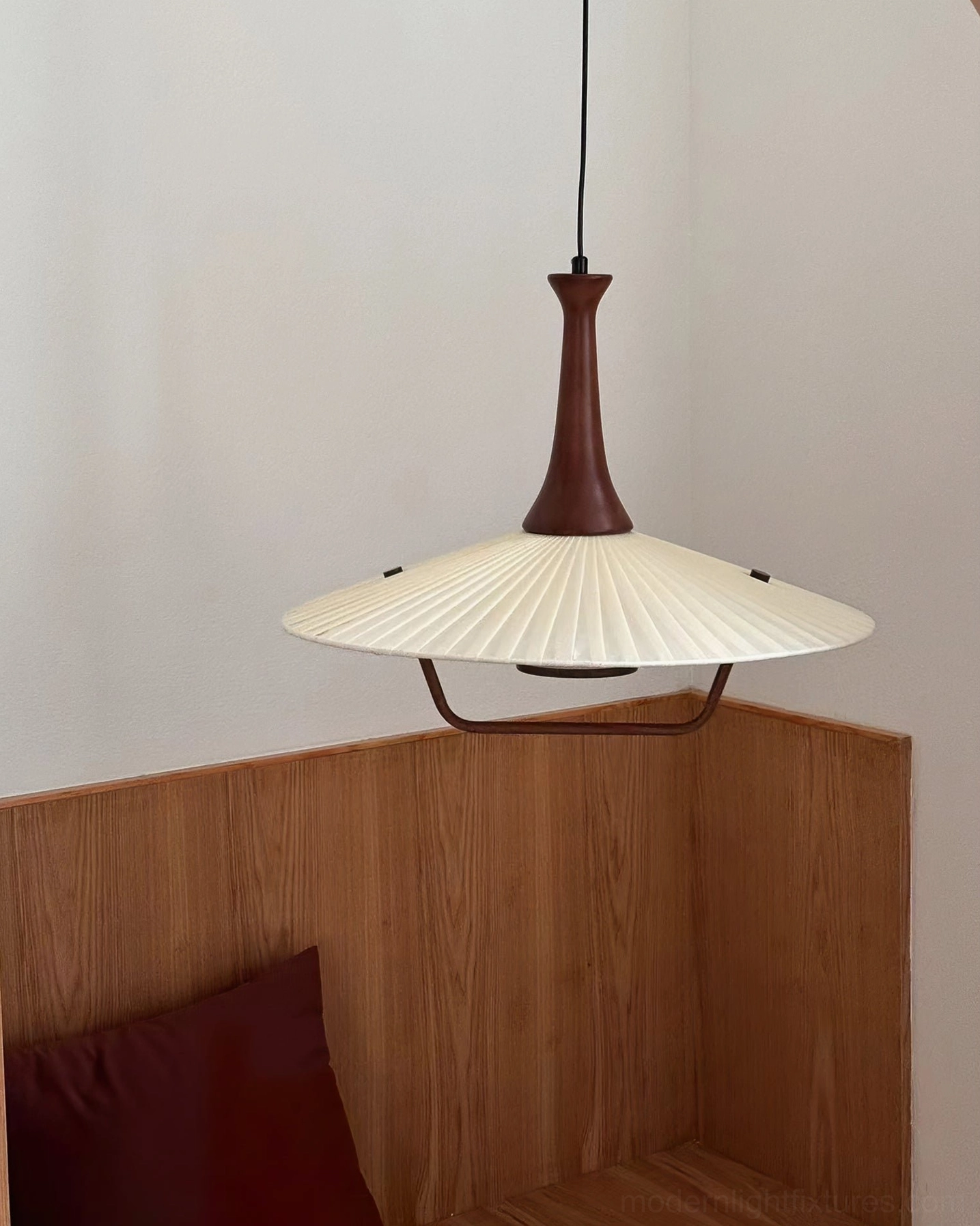 Pleated pendant lamp fabric shade shows light diffusion and accordion fold detail craftsmanship