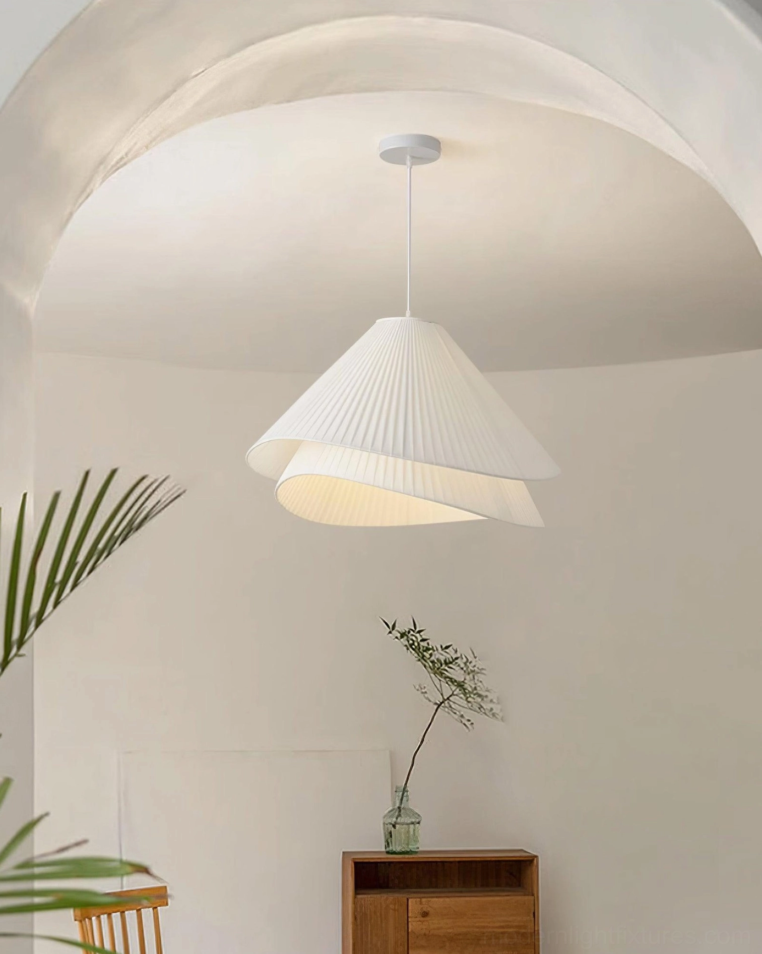 Pleated pendant light suspended at optimal dining height with visual proportion guidelines
