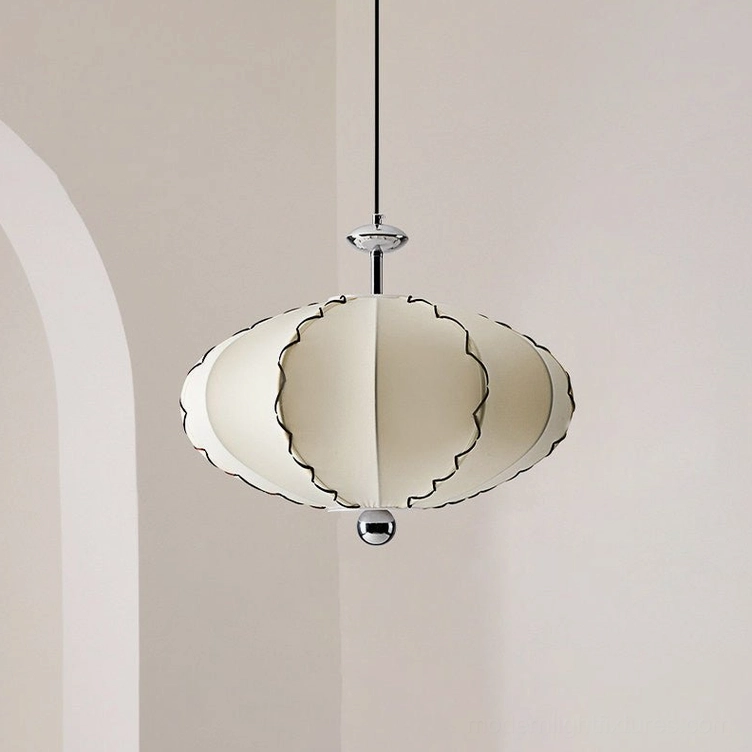 Cream pleated pendant light suspended in warm minimalist dining area with wooden table and natural textures, wide room perspective