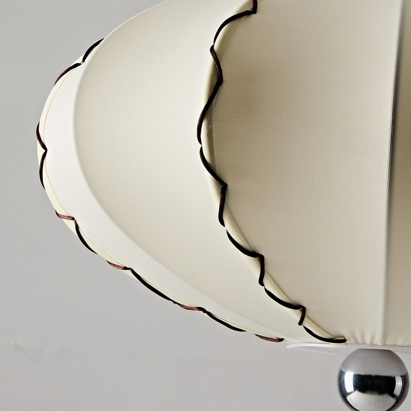 Cream pleated fabric pendant light shade in neutral warm tones with polished chrome base and adjustable suspension cable detail