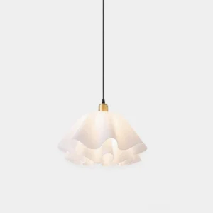 Pleated pendant light with frosted white shade and brass hardware in front low-angle studio view