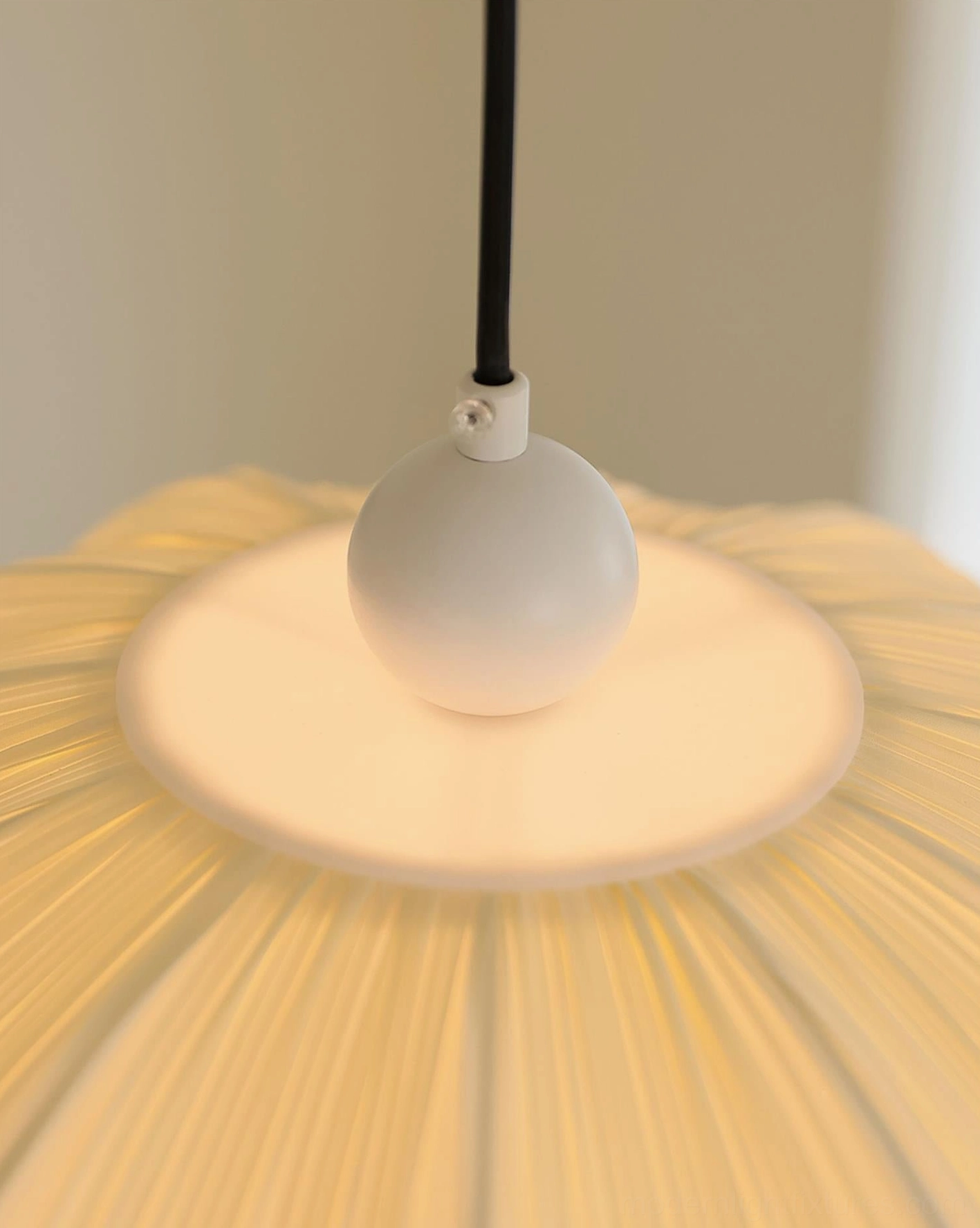 Pleated scallop pendant lamp showing sloped ceiling compatible installation, vaulted space suitable fixture