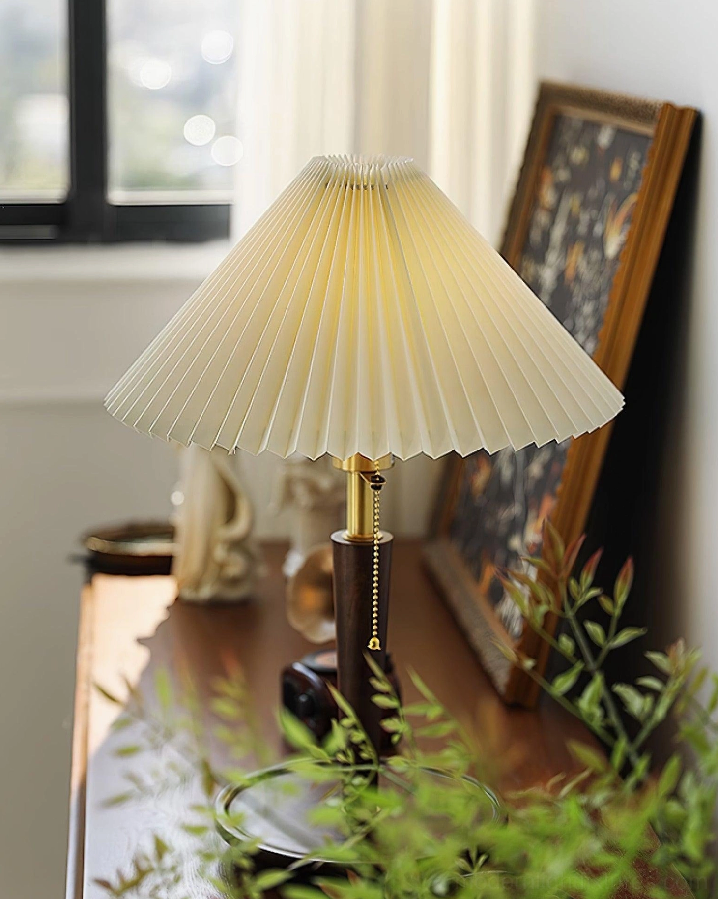 Modern pleated table lamp close-up detail of fabric pleating texture and brass hardware finish on solid wood base