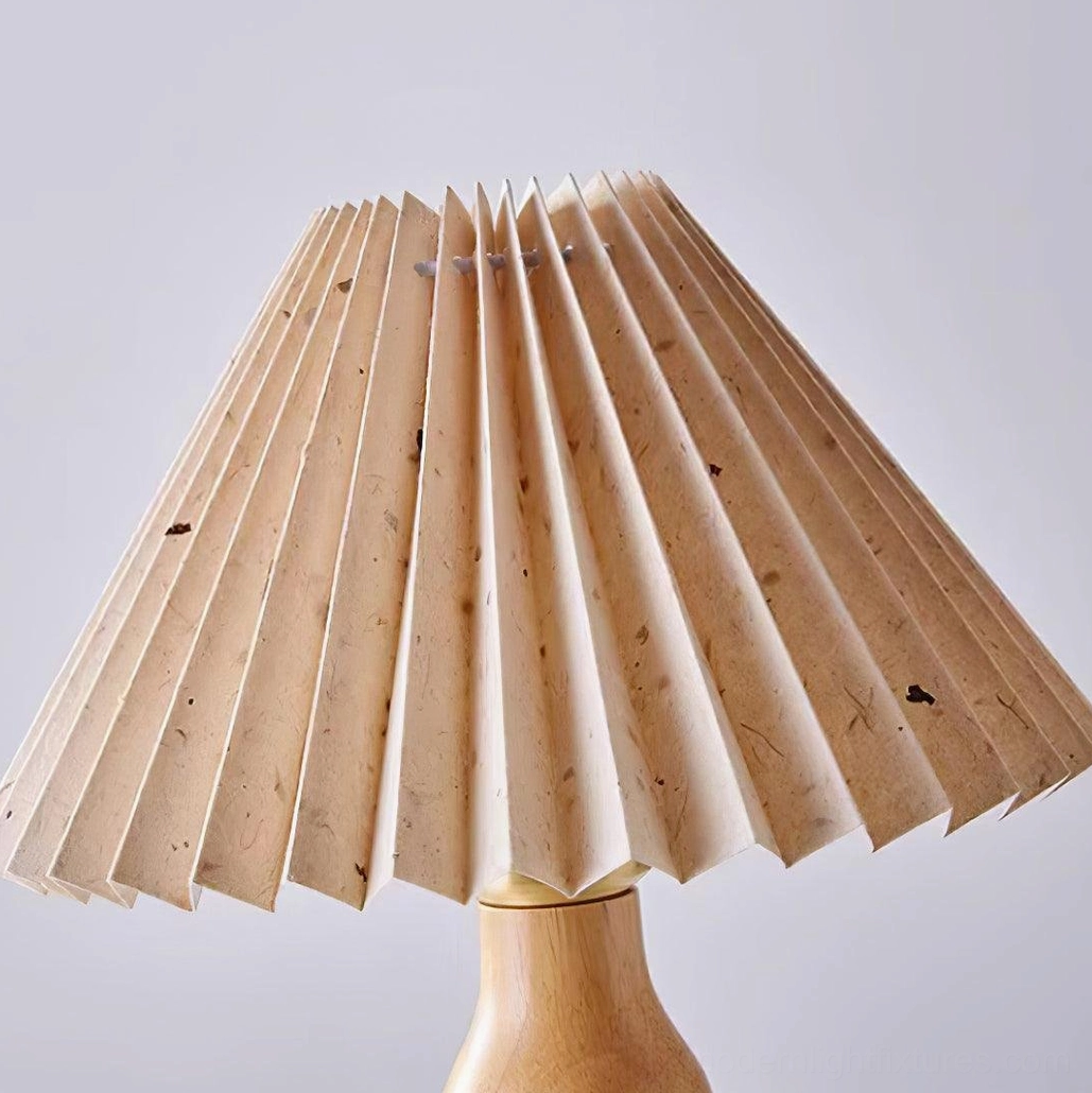 Pleated tripod table lamp close-up showcasing fabric pleating texture and minimalist retro style