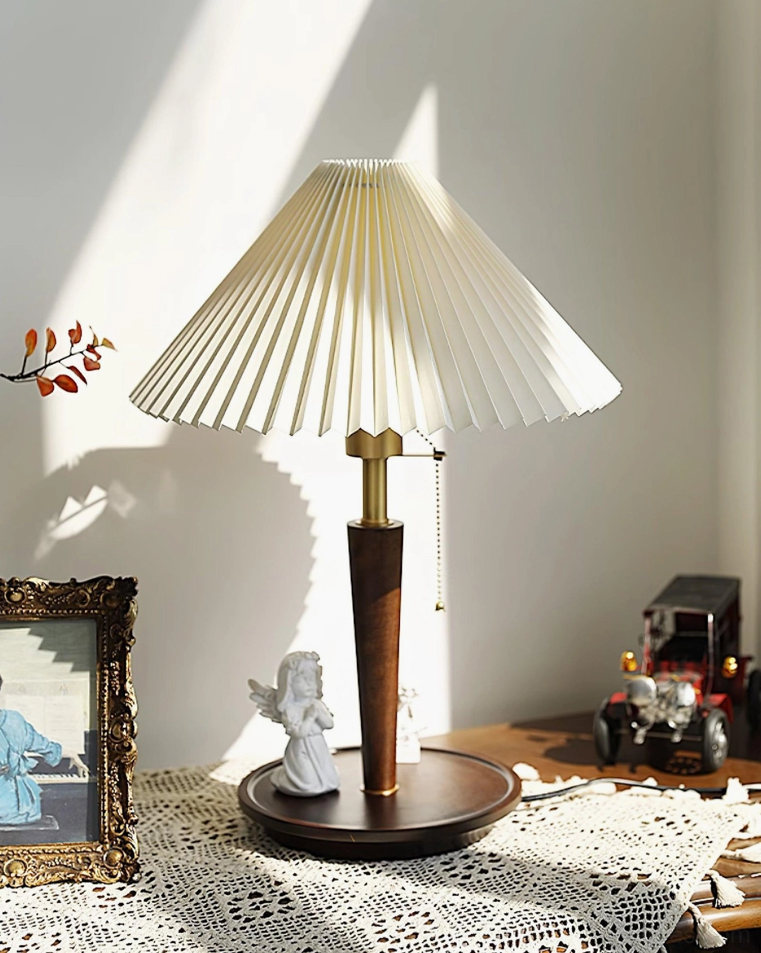 Suki pleated table lamp styled on lace-covered table with vintage ornaments, cottagecore warm retro aesthetic